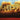 Bonobo Distance In Static album cover artwork showing abstract microscopic landscape in amber and blue tones Ninja Tune 2026