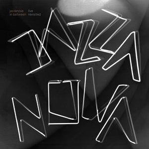 Cover art for In Between Revisited (Live) by Jazzanova, featuring a modern monochrome design with neon-style typography against a blurred abstract background.